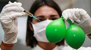 woman with needle over two baloons